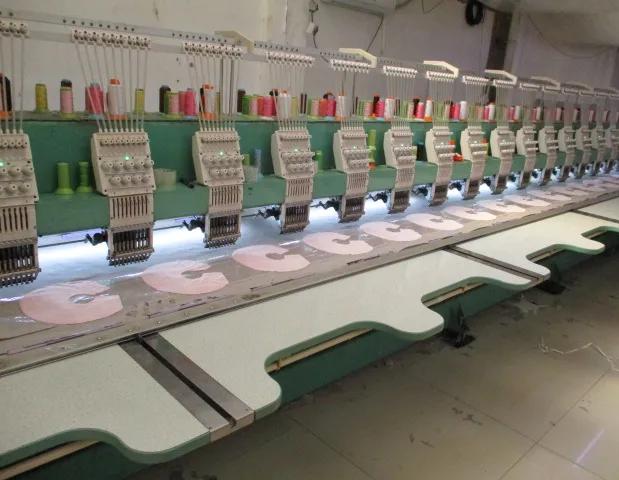 Multi-head embroidery machines stitching plush toy faces at JoyPlush Toy factory