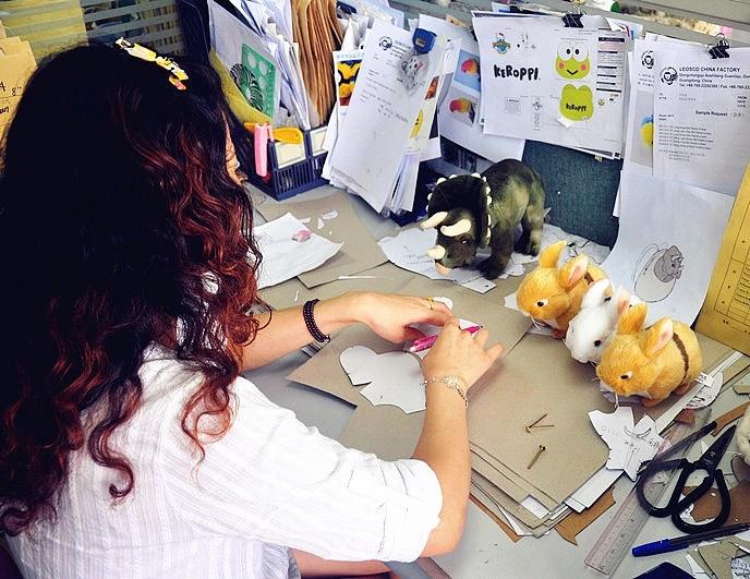 JoyPlush Toy designer creating paper patterns for custom plush toys