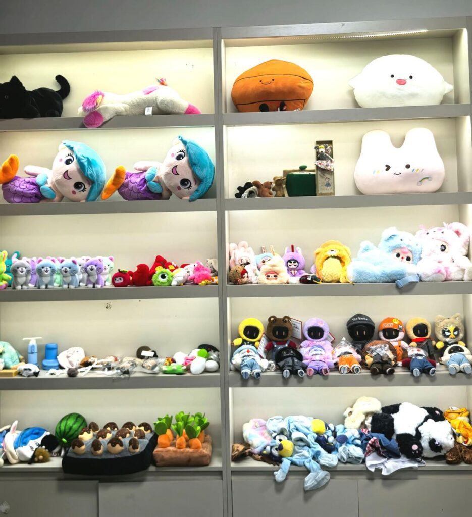 Plush toy sample showroom at JoyPlush factory, display wall 1